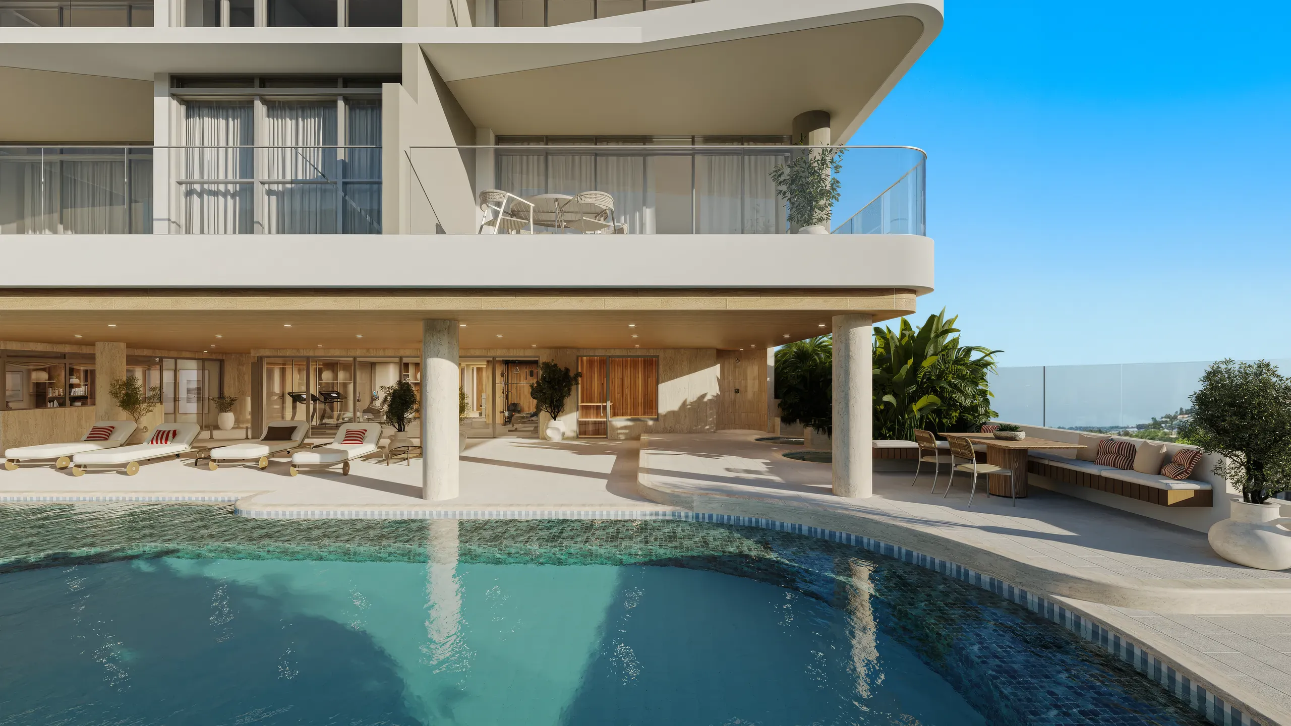 Apartment tower podium with a resort pool and sun loungers