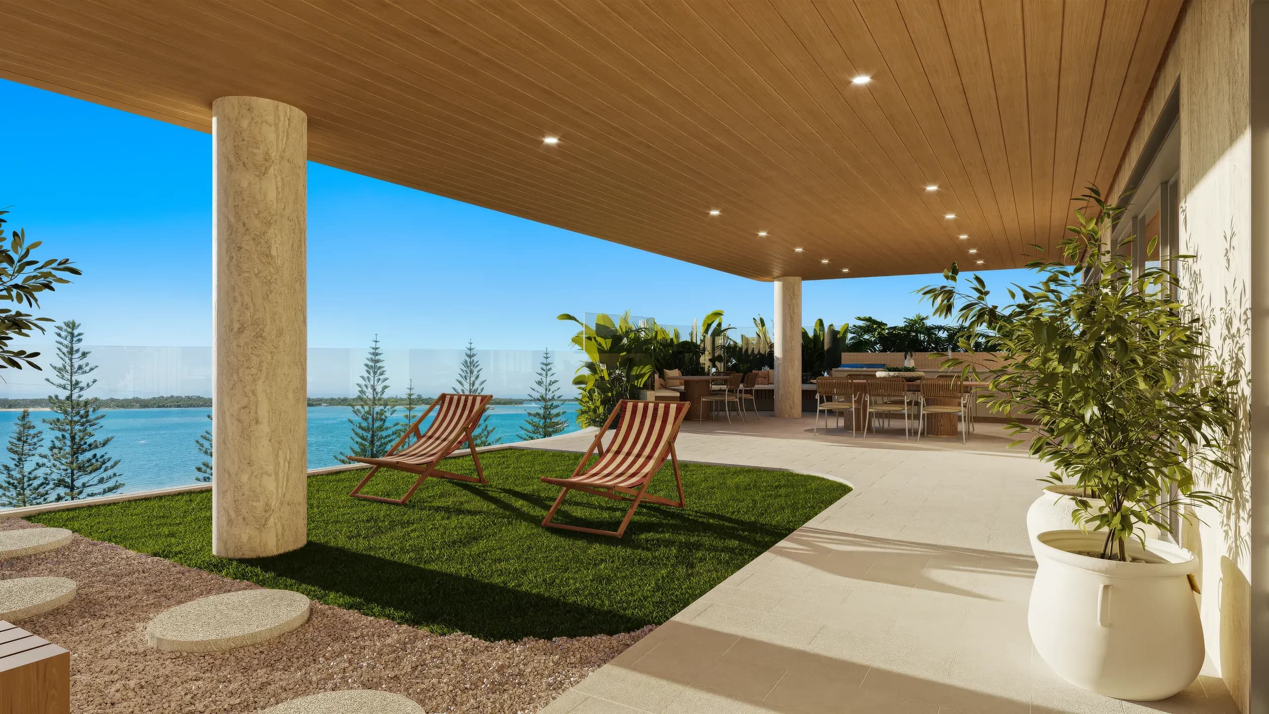 Rooftop lawn with deck chairs and olive trees facing the water