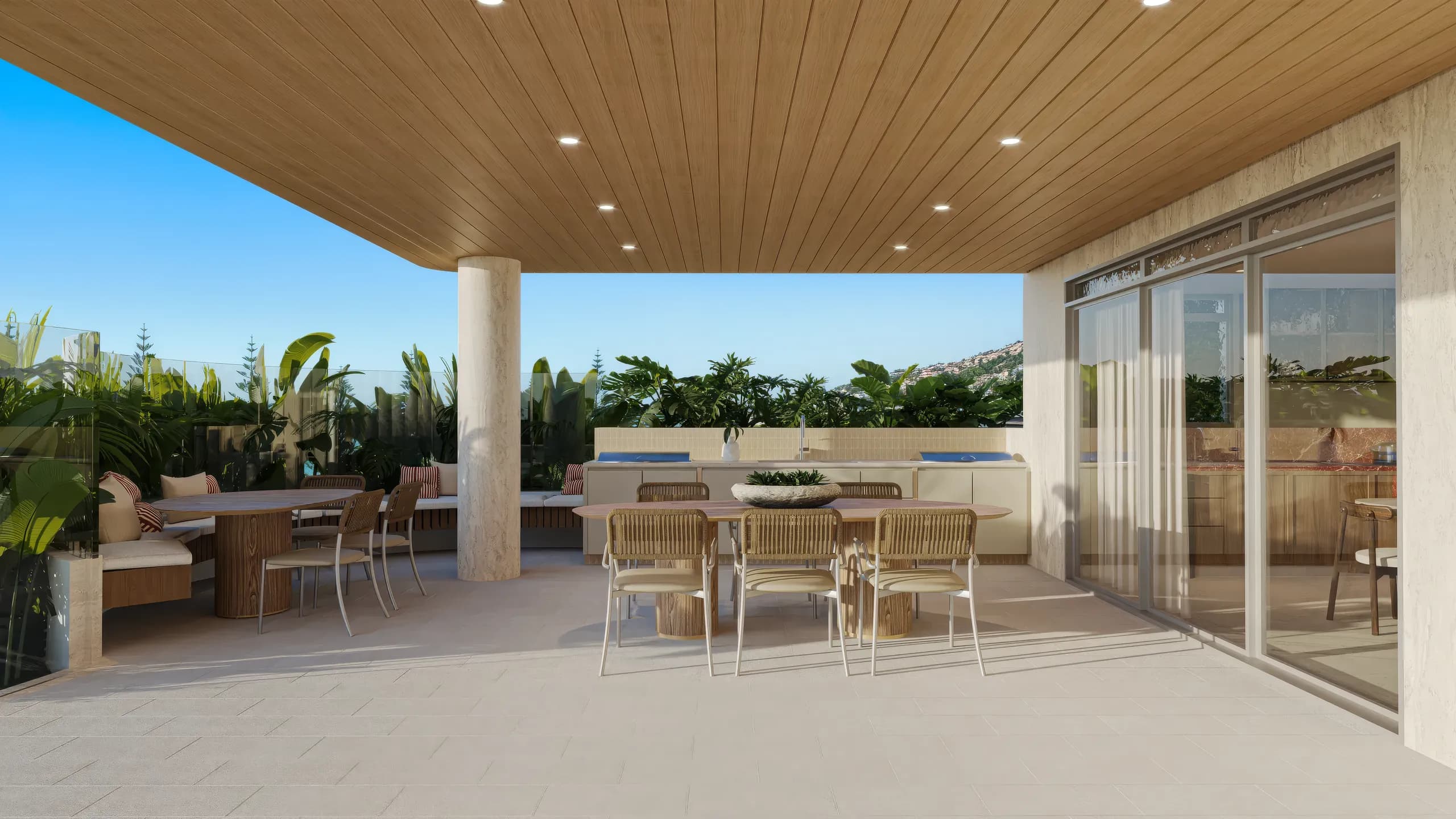 Covered rooftop terrace with an outdoor kitchen and dining